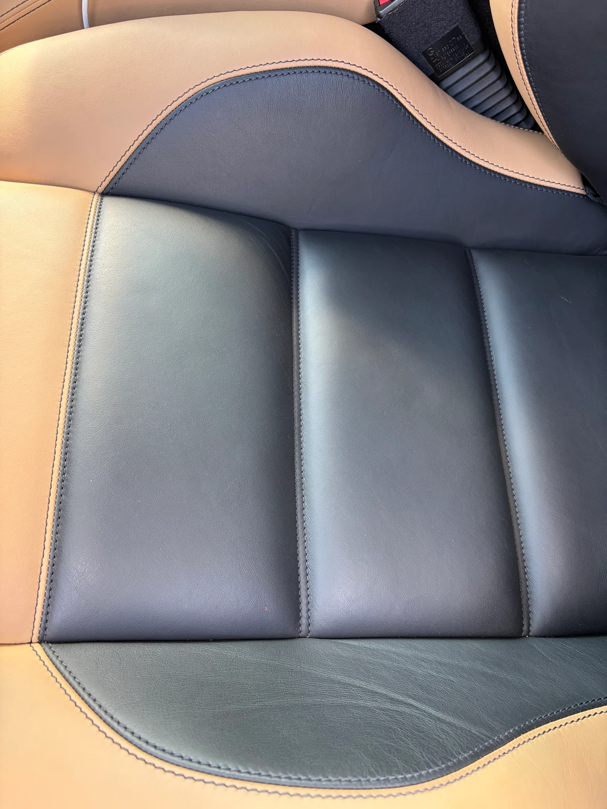 2013 Mercedes-Benz SLS AMG GT Roadster cabin after leather preservation — two-tone sand and black leather, consistent and well conserved