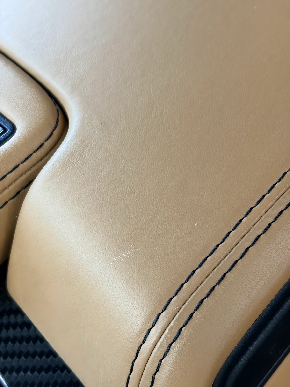 Mercedes-Benz SLS AMG GT Roadster center armrest before preservation — extremely light surface scratch visible