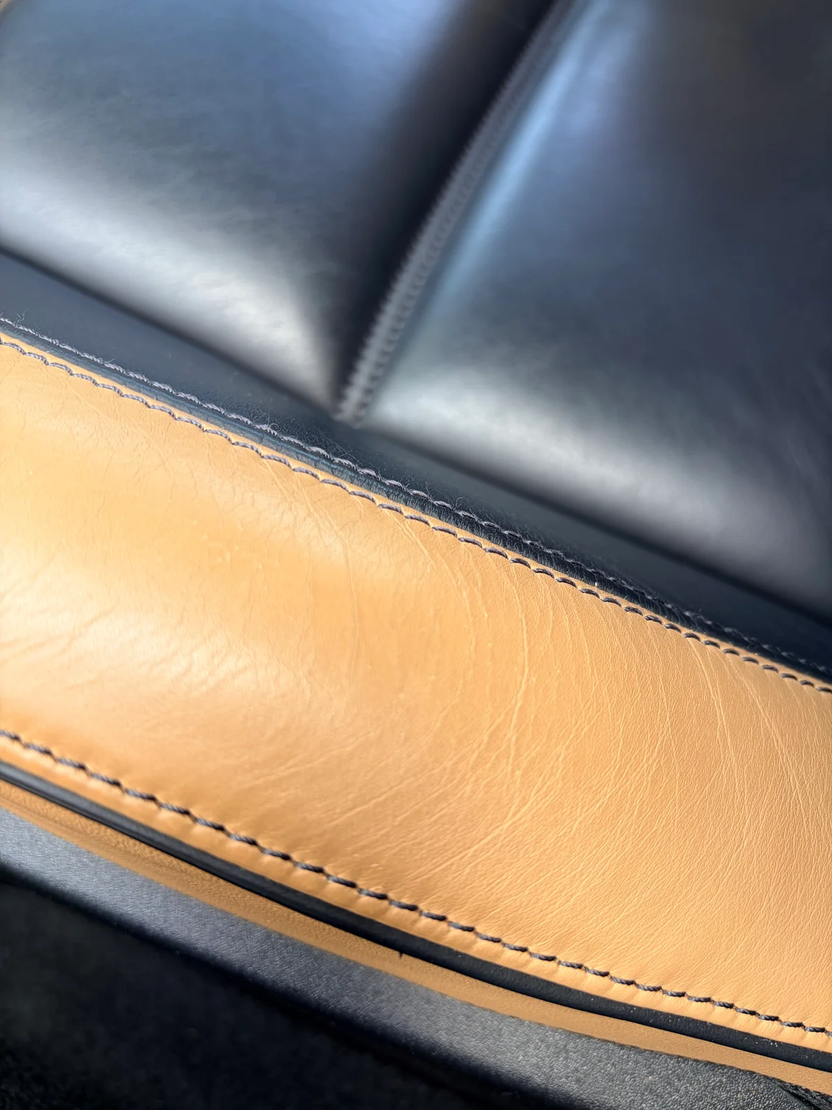 Mercedes-Benz SLS AMG GT Roadster driver's seat bolster before preservation — localized finish wear and reduced surface uniformity