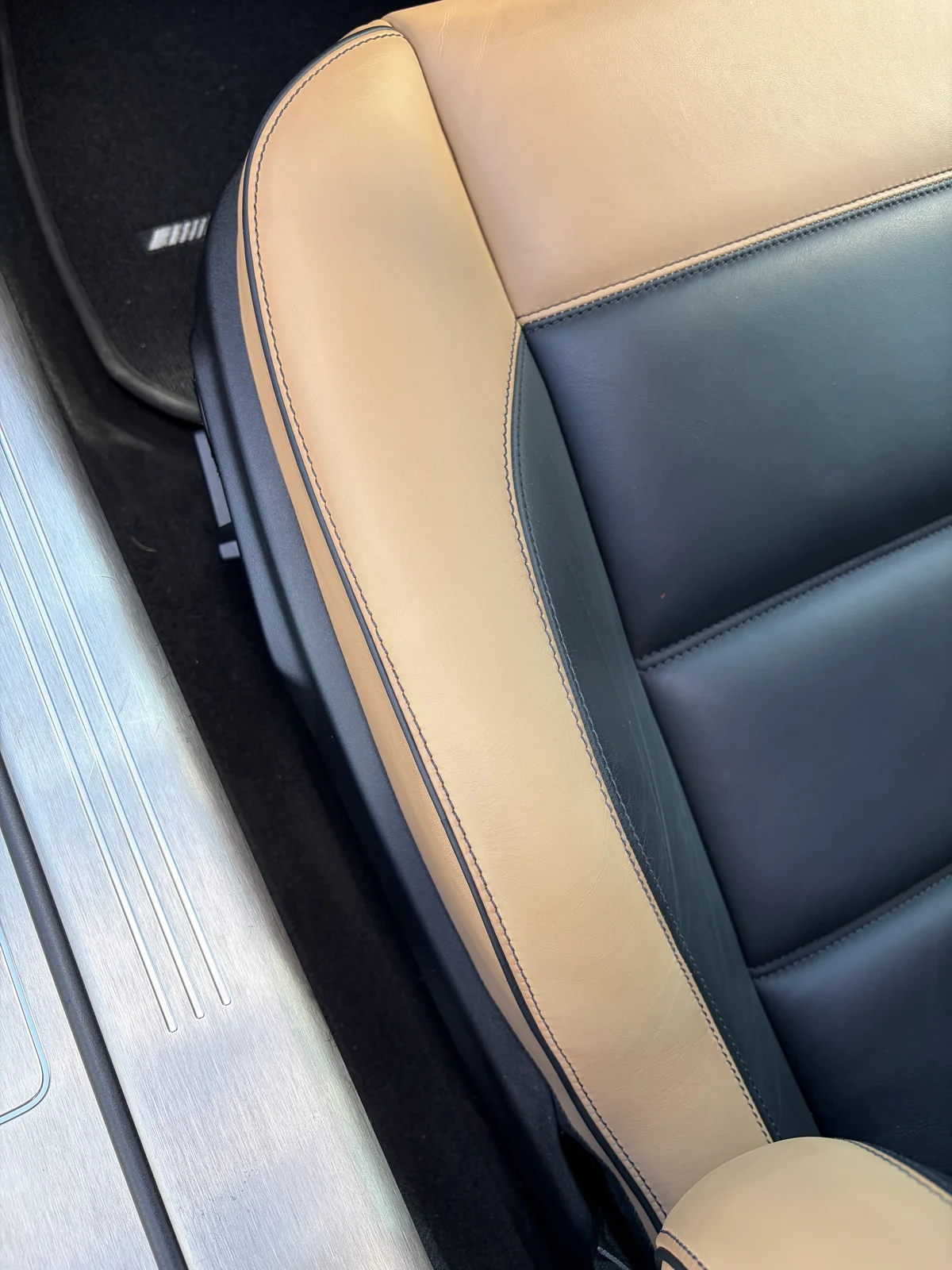 Mercedes-Benz SLS AMG GT Roadster seat bolster and door sill after preservation — clean, consistent leather surface