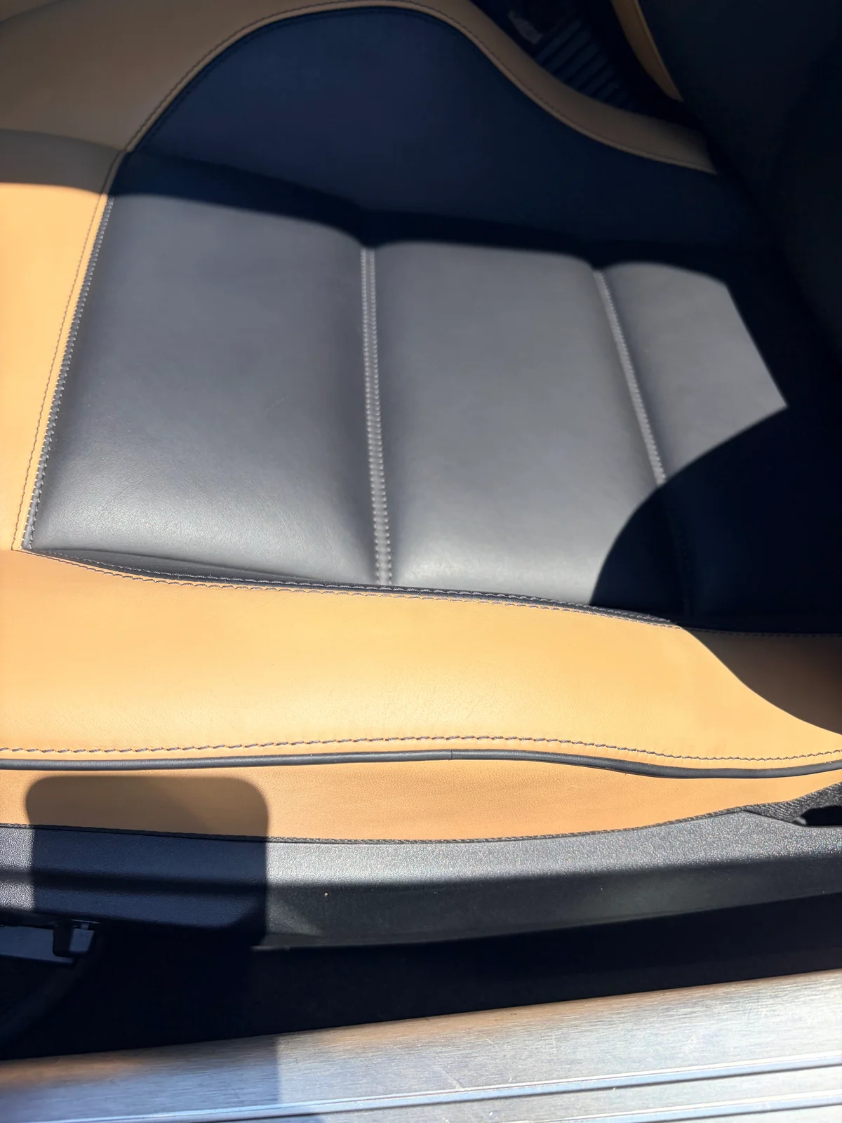 Mercedes-Benz SLS AMG GT Roadster black leather seat cushion after preservation — protective finish restored and consistent