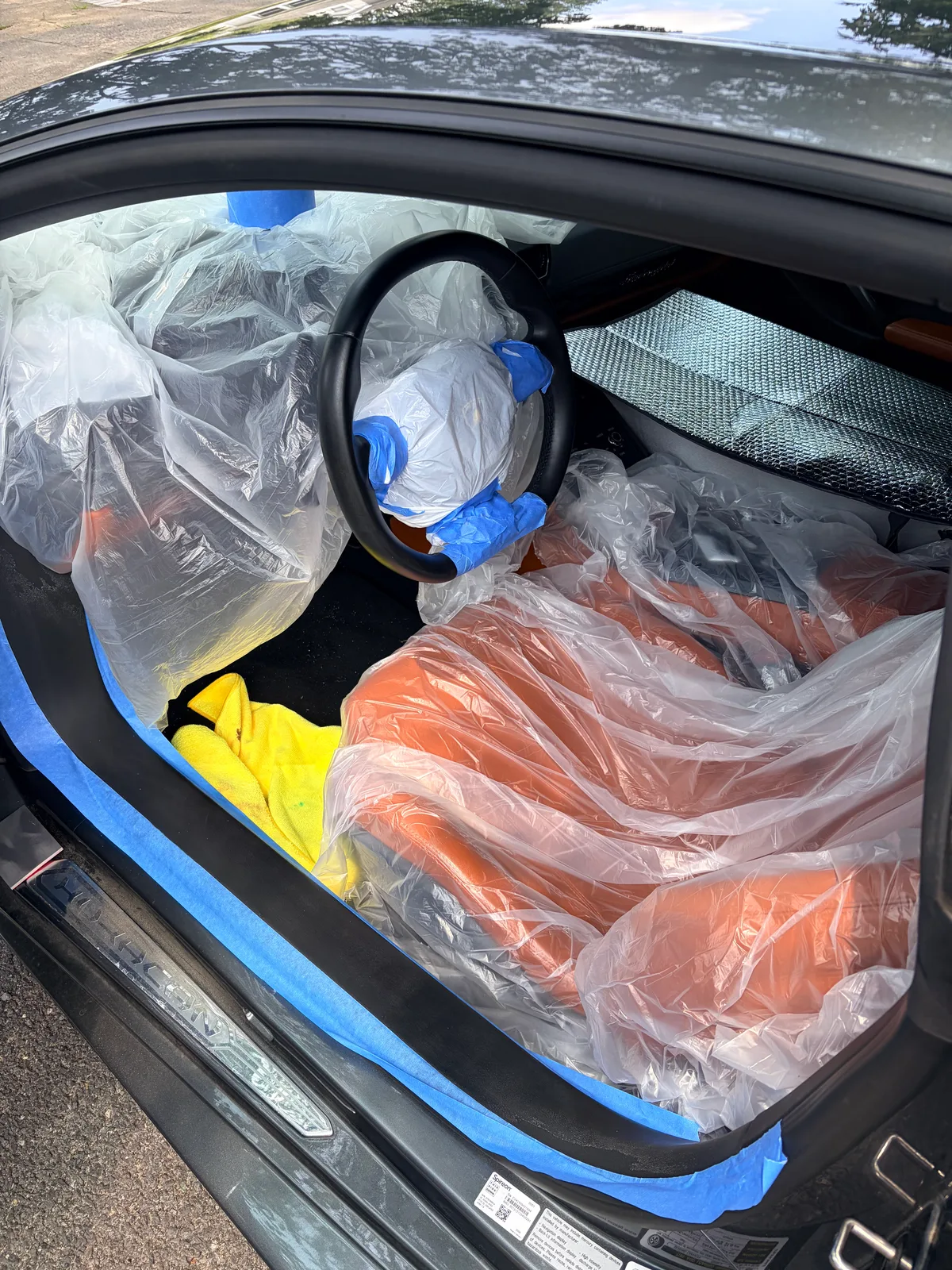Lamborghini Huracán cabin fully masked before steering wheel refinement, protecting seats, dashboard, and trim