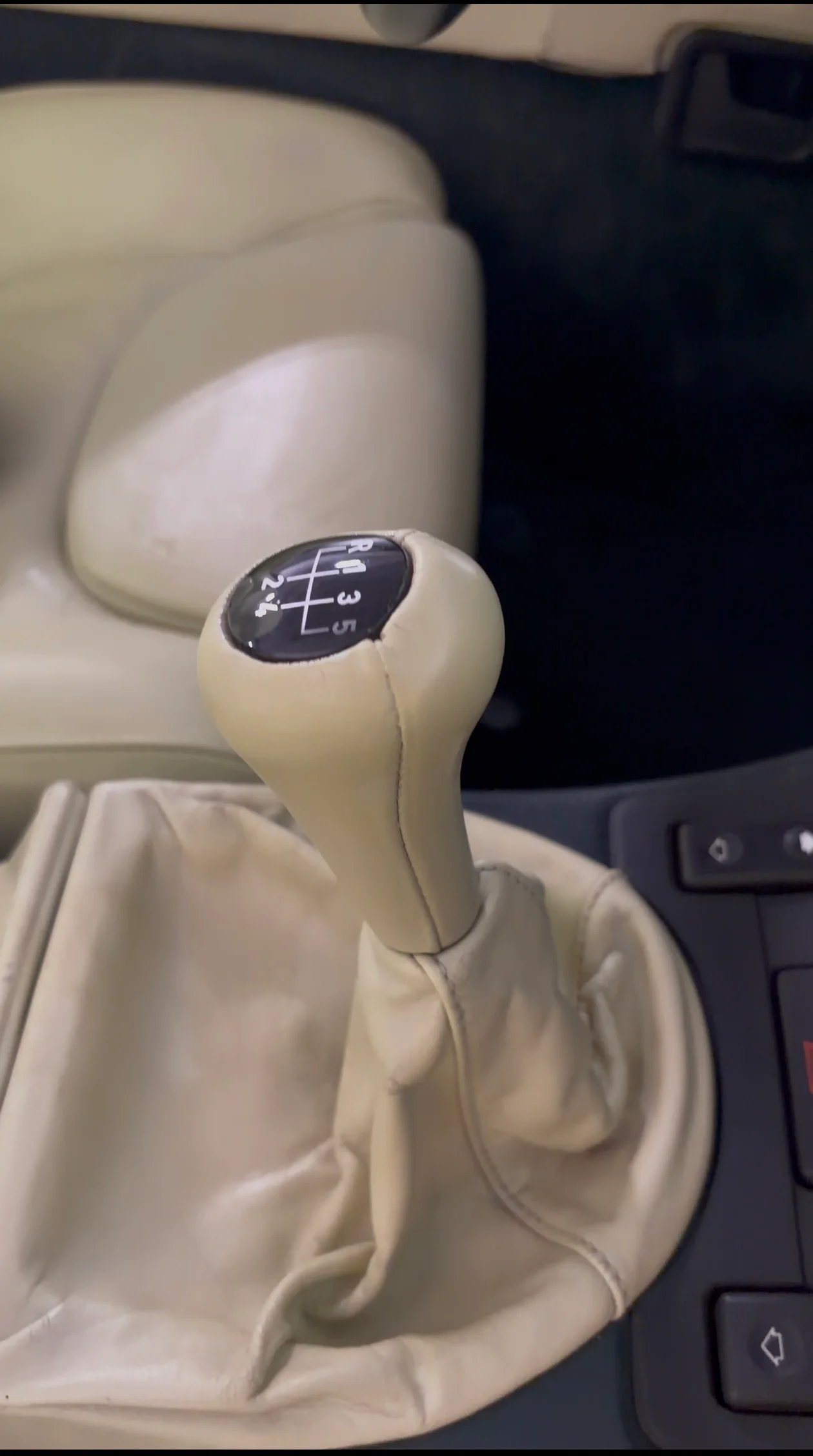 BMW Z1 leather-wrapped gear knob and shift gaiter after preservation — clean, even color, supple surface