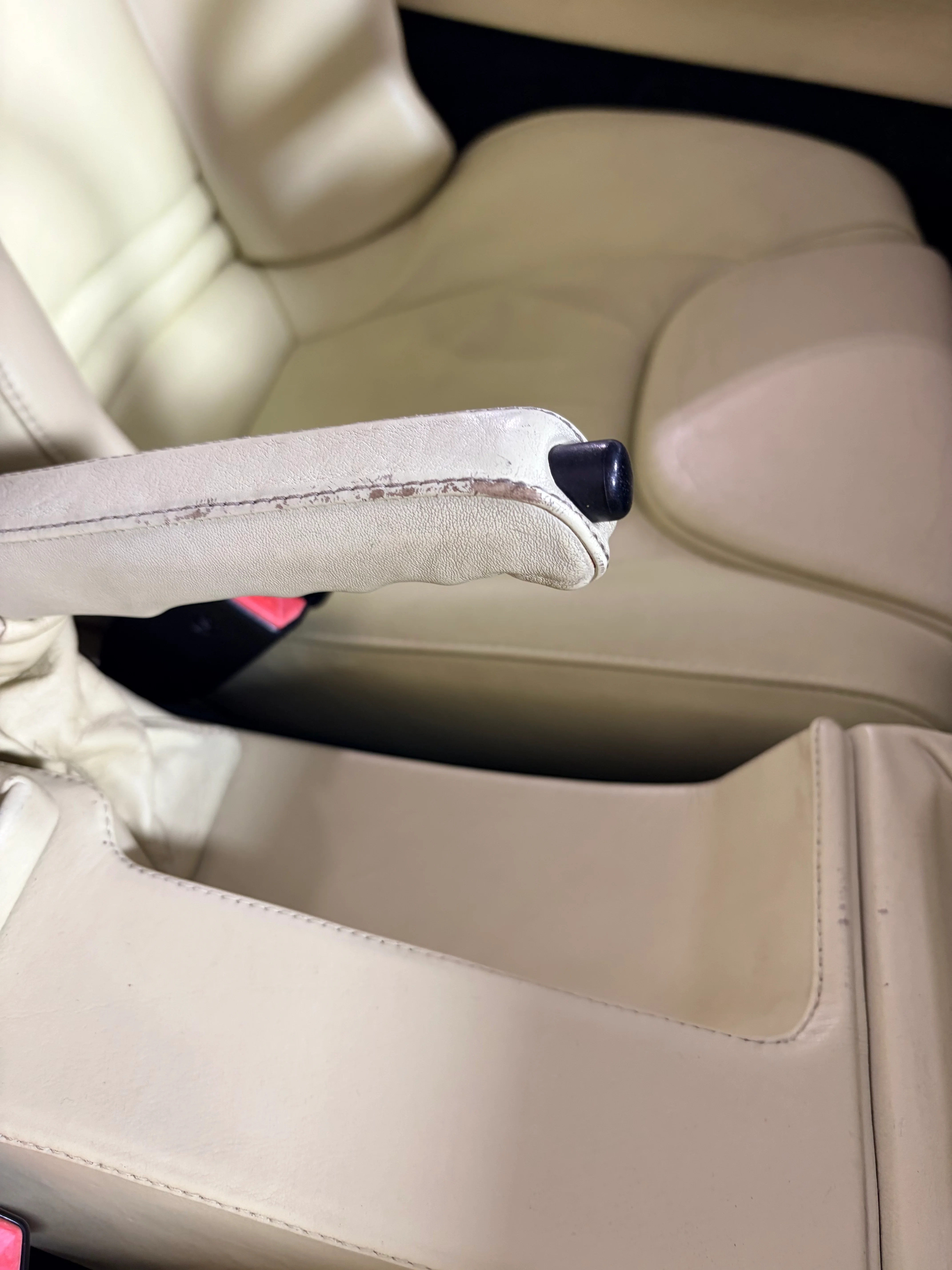 BMW Z1 leather-wrapped handbrake before preservation — seam wear and surface cracking along the grip area
