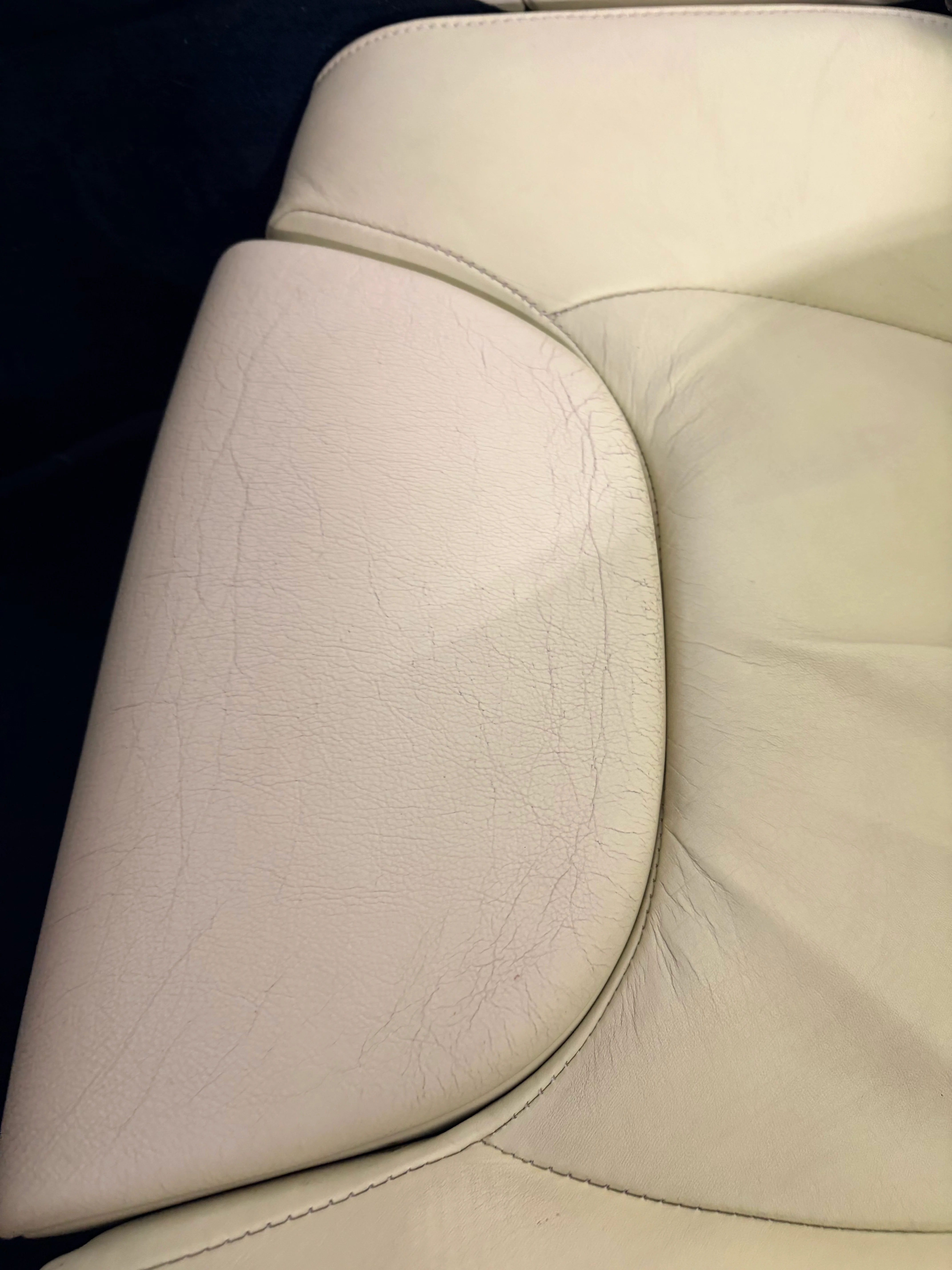 BMW Z1 seat bolster before preservation — surface cracking concentrated at the entry contact area of the lower bolster