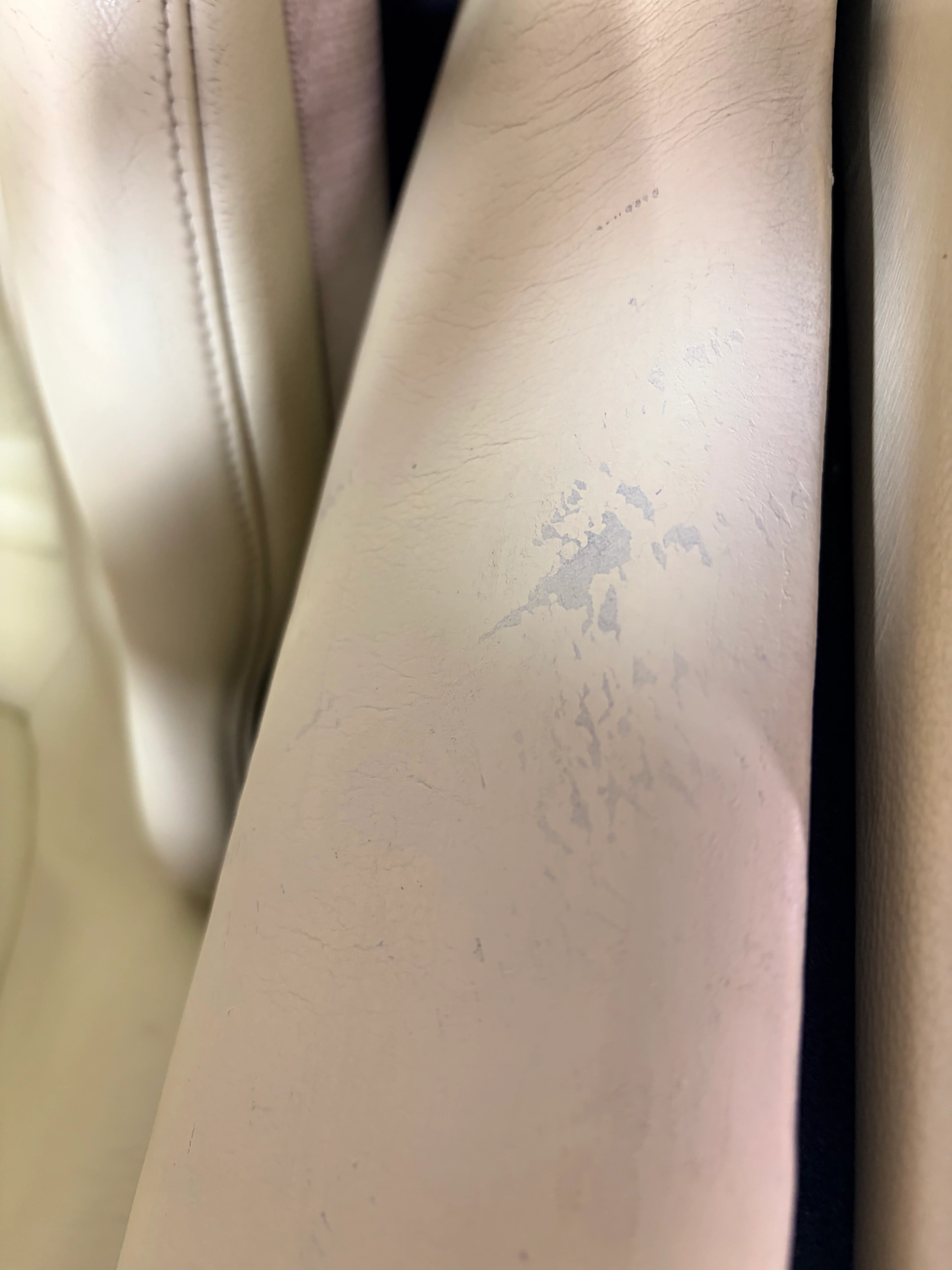BMW Z1 leather sill panel before preservation — surface contamination, discoloration patches, and transfer marks from repeated entry contact