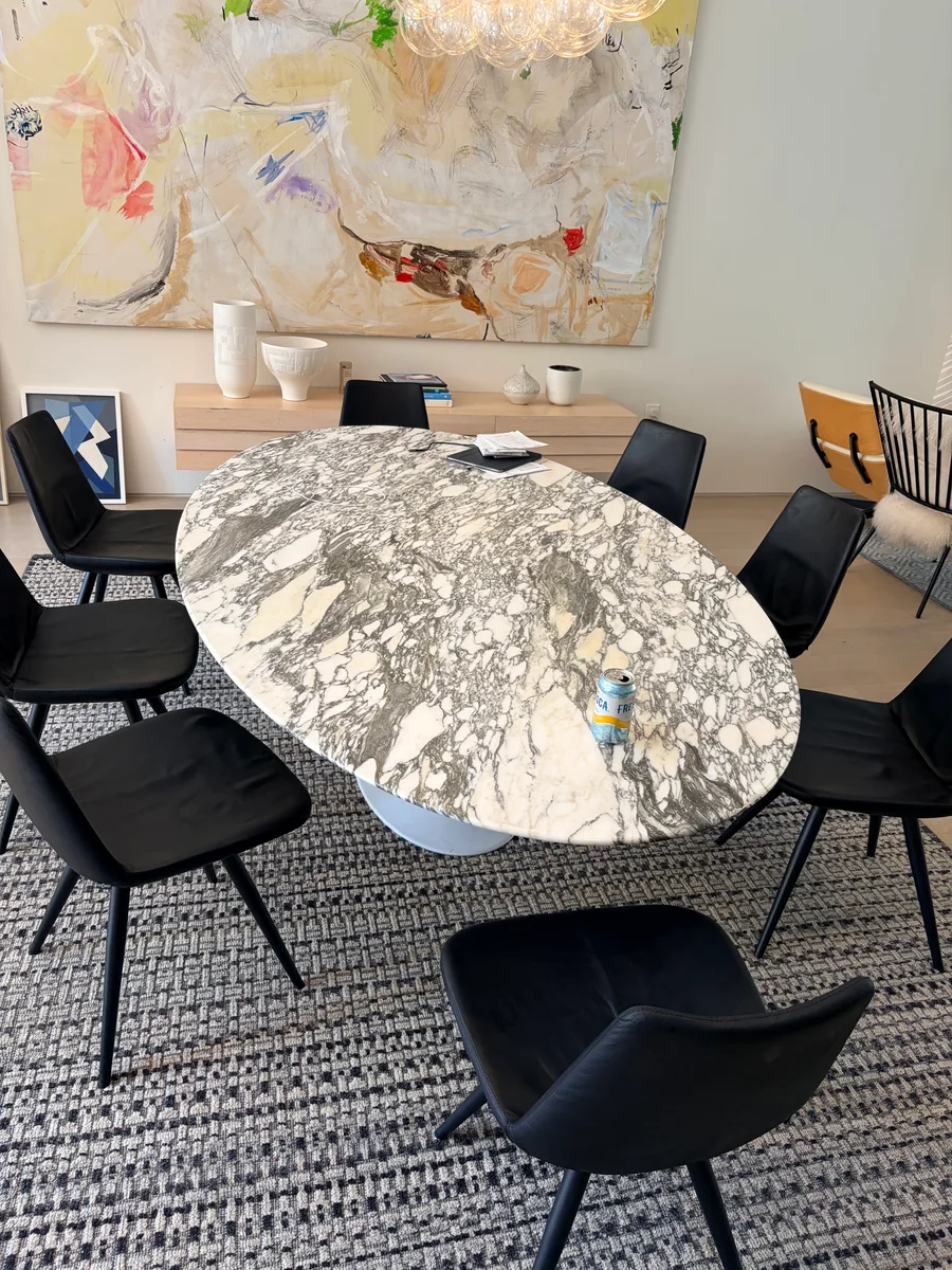 Eight black leather chairs after cat-scratch surface restoration in Clinton Hill, Brooklyn