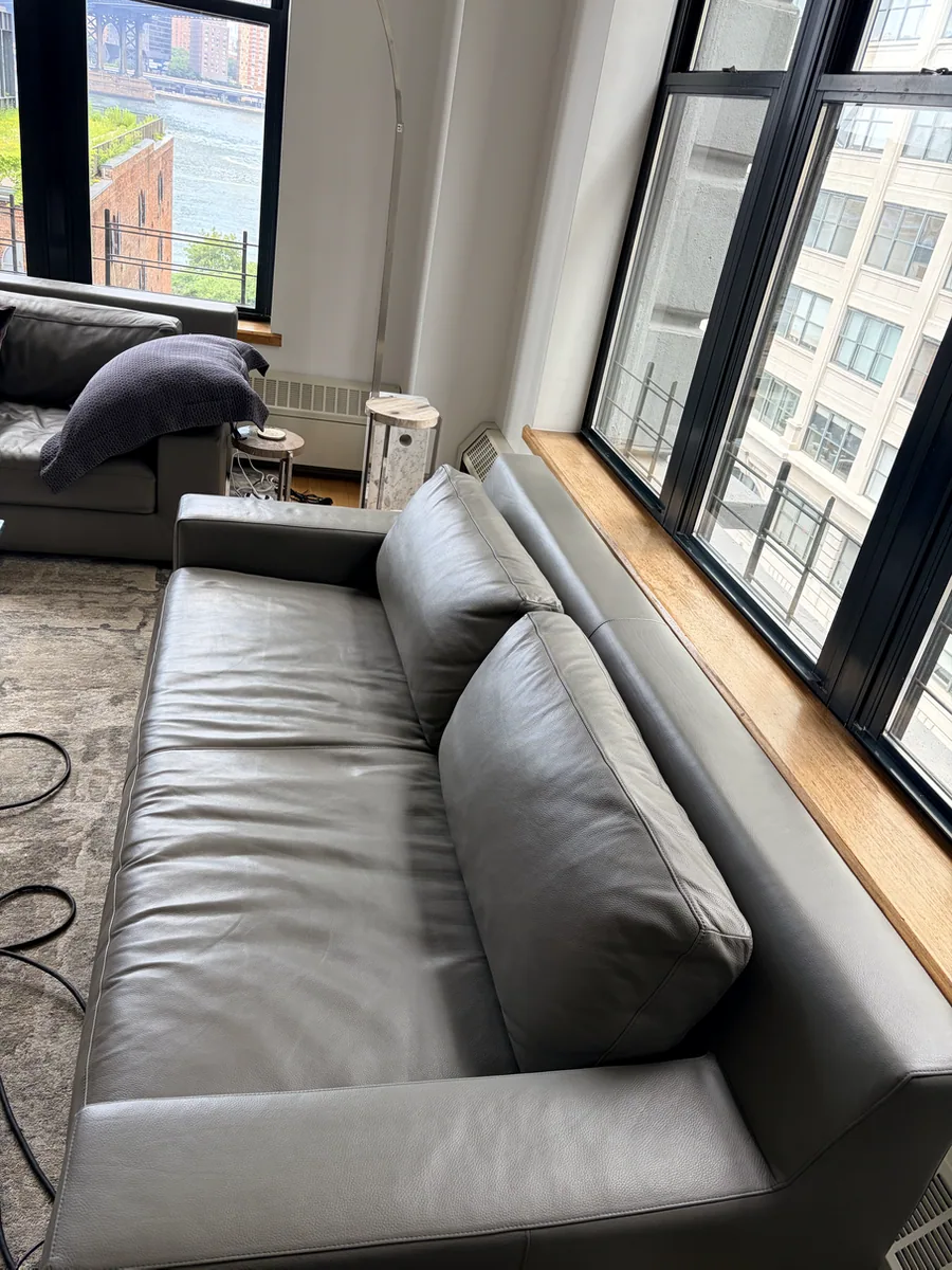 Restored gray leather sofa after dog scratch repair in DUMBO, Brooklyn