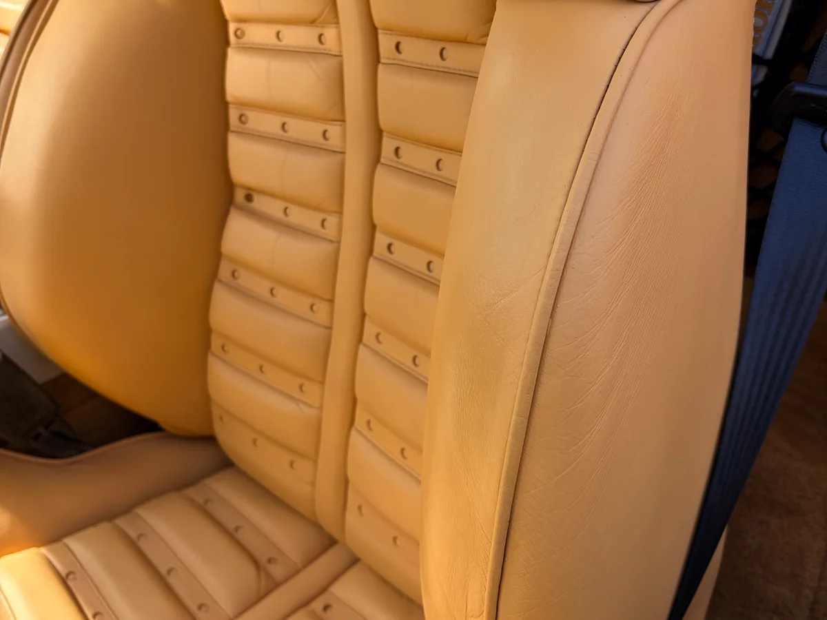 Ferrari 360 Modena both seats after leather restoration — beige Cuoio leather color consistent and uniform