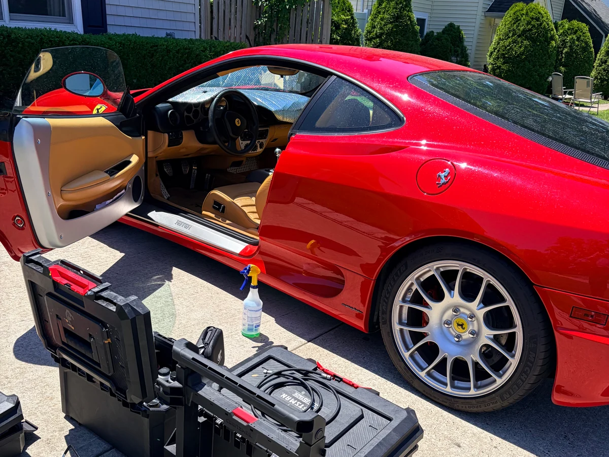 1999 Ferrari 360 Modena in Rosso Corsa on driveway — full interior leather restoration case study by Leather & Vinyl Care NJ