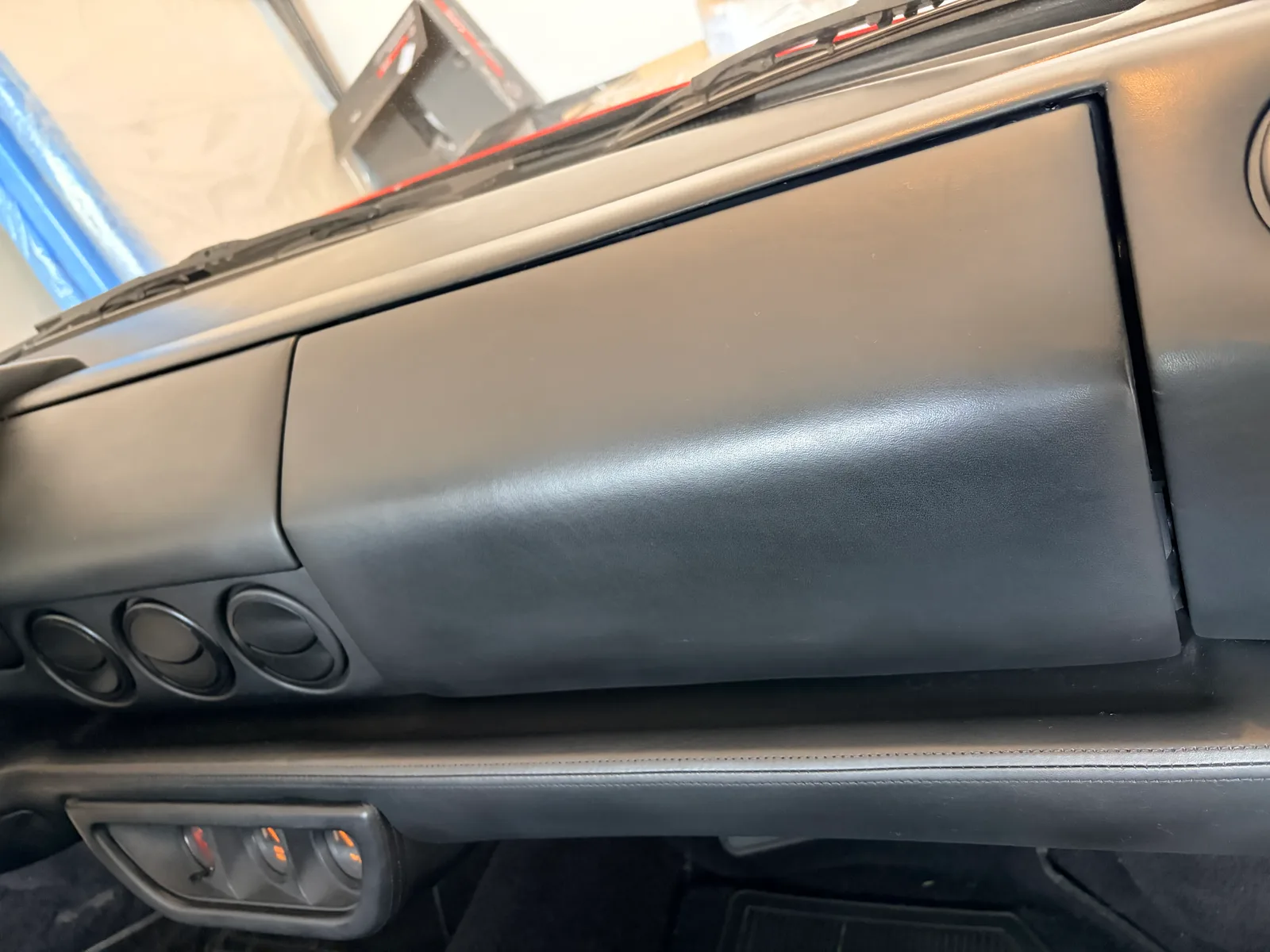 Ferrari 512 TR dashboard leather refresh — cosmetic touch-ups and surface correction completed