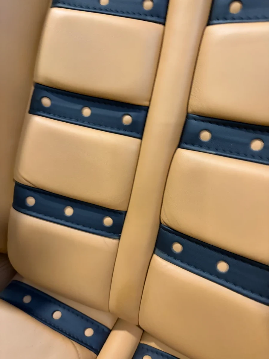 Ferrari F430 Daytona seat back from above after restoration — Cuoio leather and black insert pattern visible