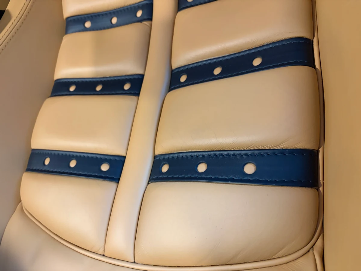 Ferrari F430 Daytona seat insert detail after restoration — black leather inserts clean with correct Cuoio surround