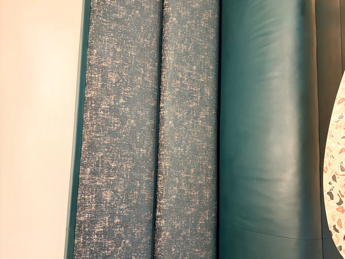 Teal leather sofa after color restoration — back and seat area showing uniform teal leather
